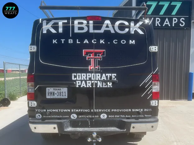 A close-up shot of a company logo on a wrapped van door.